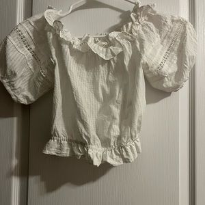 Off the shoulder ruffled cropped white shirt.